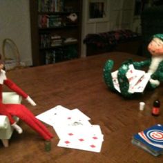 the elf is playing cards on the table