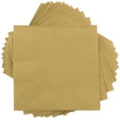 gold paper napkins are stacked on top of each other