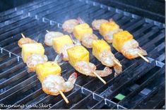 shrimp and pineapple skewers cooking on the grill