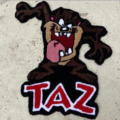 a sticker with the word taz on it