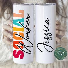 two white coffee mugs with the words sister and sister on them, one is holding up