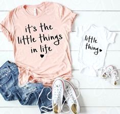 two t - shirts with the words mother of 4 and fighter on them next to some shoes