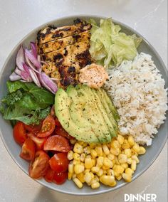 a bowl filled with meat, rice and veggies