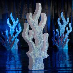 some very pretty blue and white corals in the dark night light up stage show