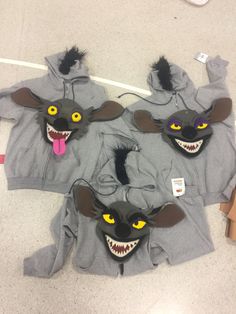 three gray hoodies with black ears and yellow eyes are shown in the shape of mice