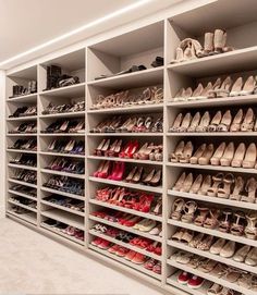 a large white shoe rack filled with lots of shoes