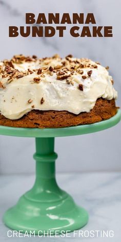 a banana bundt cake with cream cheese frosting and chopped pecans on top