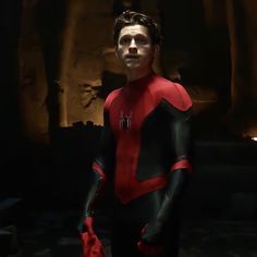 a man in a red and black spider suit