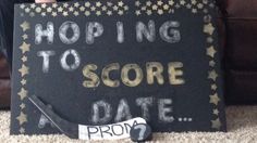 a sign that says, hoping to score a date from proms on the floor