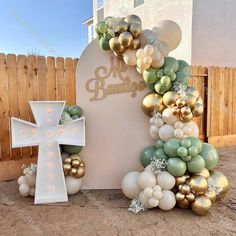 a large balloon arch with a cross on it