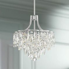 a crystal chandelier hanging from a ceiling