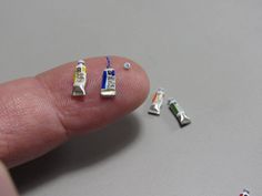 a finger with some tiny pins on it