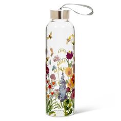 a glass water bottle with flowers painted on the side and a silver lid is shown in front of a white background