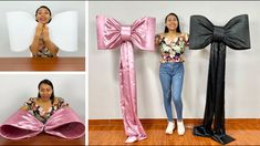 a woman standing next to two giant bow shaped objects on top of a wooden floor