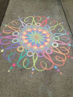 the sidewalk has been decorated with colored crayons