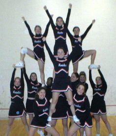 a group of cheerleaders are posing for a photo