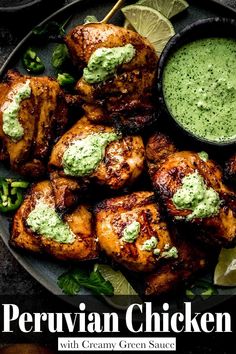 grilled chicken with green sauce and garnishes on a plate next to lime wedges