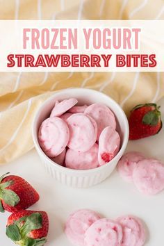 frozen yogurt strawberry bites in a white bowl with strawberries on the side