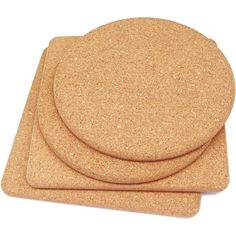 three cork coasters sitting on top of each other in front of a white background