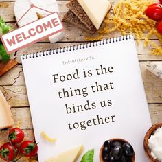 food is the thing that binds us together written on a notebook surrounded by other foods