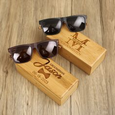 two wooden sunglasses are on display with their case and wood box that says, mr and mrs