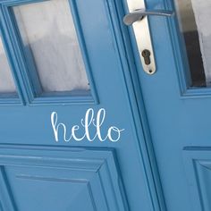 a blue door with the word hello painted on it's side and an open handle