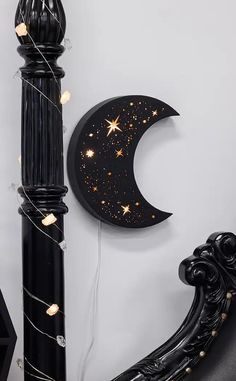 the moon and stars are hanging on the wall