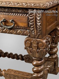 an ornate carved wooden table with drawers