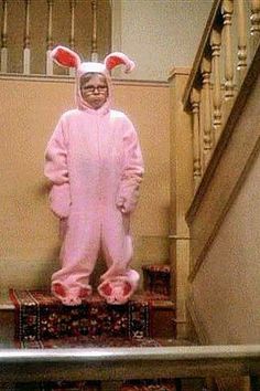 a person in a pink bunny costume standing