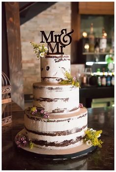 a three tiered cake sitting on top of a table