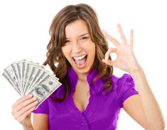 a woman is holding money and making the peace sign