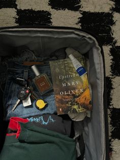 A suitcase with clothes, cologne, a book, and keys Travel Bag Aesthetic, Packing For A Trip, Mary Oliver, Tree Hugger, Granola Girl, Girl House, Book Inspiration, Dream Life, Aesthetic Pictures