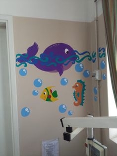 a child's room decorated with sea animals and bubbles