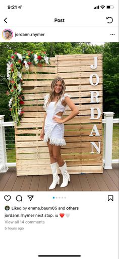 a woman standing in front of a wooden sign with the word jordan written on it