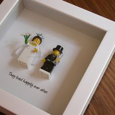 two legos are in a white box with the words yes, they loved happily over after