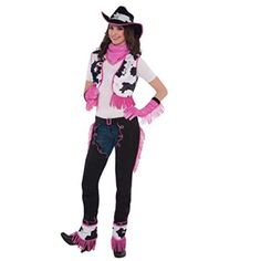 a woman in a cowgirl costume posing for the camera