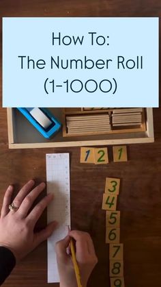 someone is writing numbers on paper next to a wooden box with tape and pencils