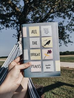 someone is reading a book in a hammock with the words all the bright places on it