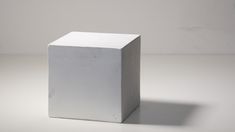 a white cube sitting on top of a table