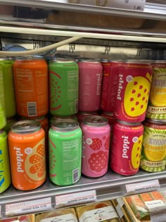 many cans of soda on display in a store