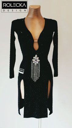 a black dress with beaded details on it