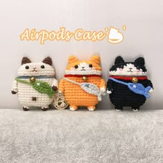 three small crocheted animals sitting next to each other on a white surface with the words airpods case written above them