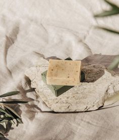 a soap bar sitting on top of a rock