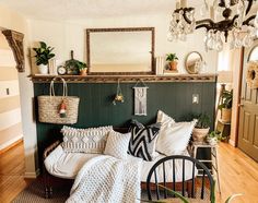 a living room filled with lots of furniture and decor