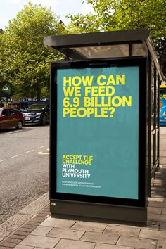 a bus stop sitting on the side of a road