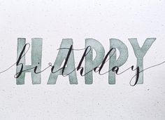 the word happy written in cursive writing on a white paper with black ink