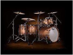 an image of a drum set with cycs and drumsticks in the background