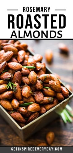 roasted almonds in a tin with rosemary on top and text overlay reading rosemary roasted almonds