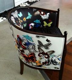 a chair with butterflies painted on it