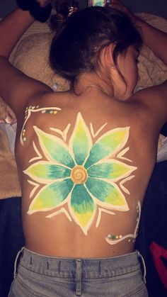 a woman with her back painted like a flower